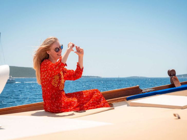 DONA Custom Sailing Yacht 25m - guest having fun DONA Custom Sailing Yacht 25m - guest having fun