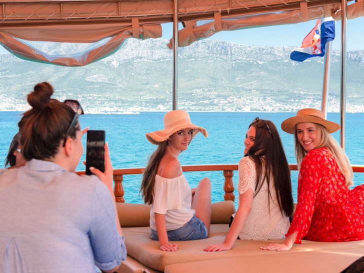 DONA Custom Sailing Yacht 25m - guests in the aft seating area DONA Custom Sailing Yacht 25m - guests in the aft seating area