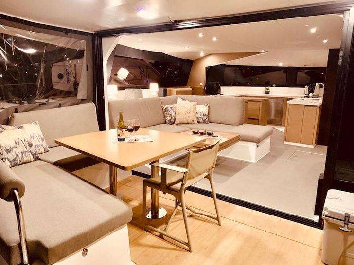 A wonderful cockpit/saloon area that brings the two together in massive outdoor living thanks to the glass sliding doors.
