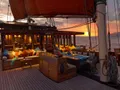 SI DATU BUA Phinisi 40m - upper deck lounge and dining area at night SI DATU BUA Phinisi 40m - upper deck lounge and dining area at night