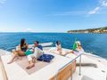 SHANGRA - Custom Line Navetta 87 ft,guests sunbathing and gathering SHANGRA - Custom Line Navetta 87 ft,guests sunbathing and gathering