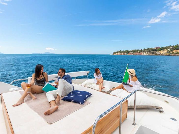 SHANGRA - Custom Line Navetta 87 ft,guests sunbathing and gathering SHANGRA - Custom Line Navetta 87 ft,guests sunbathing and gathering