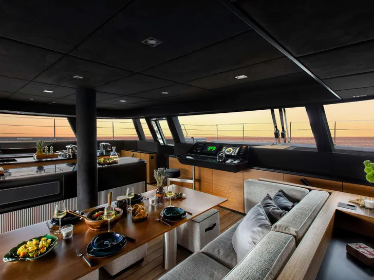 CALMA Sunreef 60 - indoor dining set up CALMA Sunreef 60 - indoor dining set up