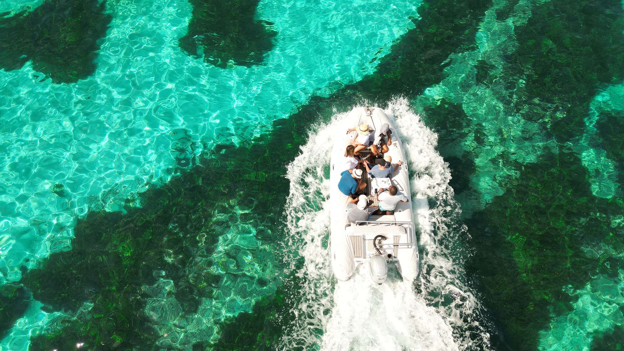 REVE2MER Lagoon 620 - dinghy cruising across the clear water