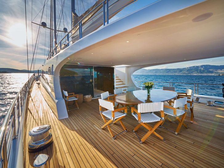 ACAPELLA Leda Motor Sailer 49m - aft deck dining table ACAPELLA Leda Motor Sailer 49m - aft deck dining table