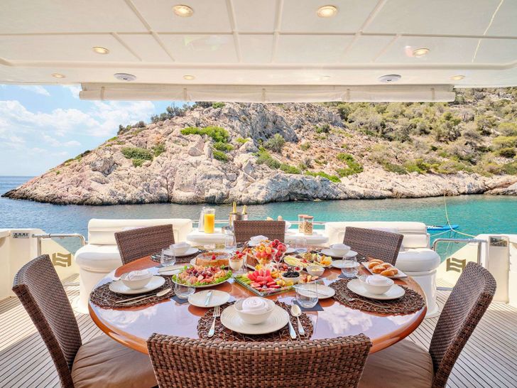 ESTIA YI Ferretti 880 - aft deck dining set up ESTIA YI Ferretti 880 - aft deck dining set up