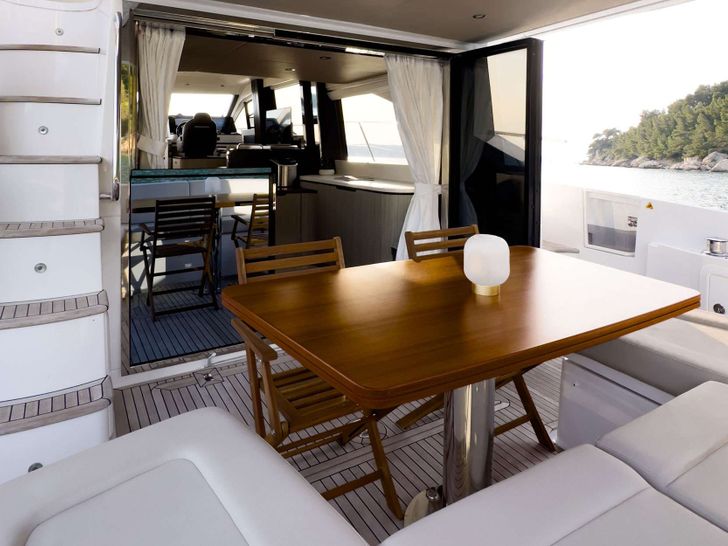 BE HAPPY Azimut 55 - aft deck seating and dining area BE HAPPY Azimut 55 - aft deck seating and dining area