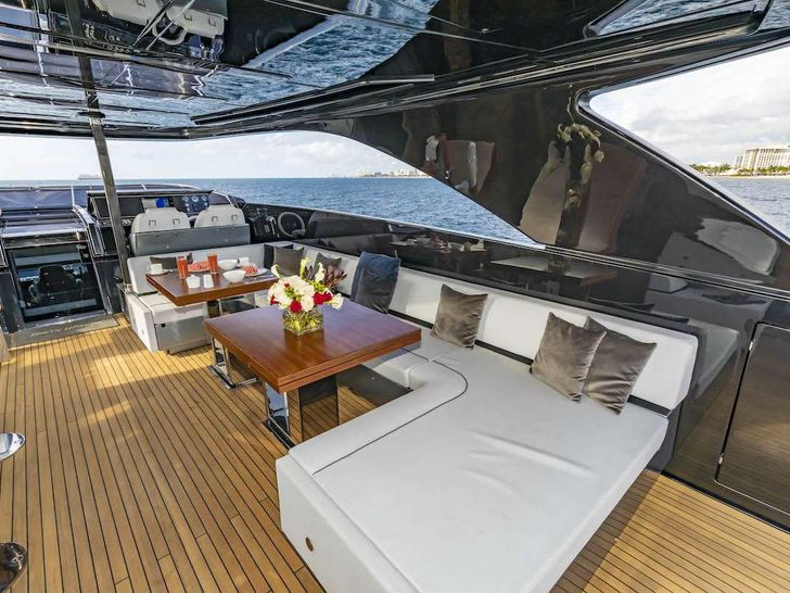 NO SURRENDER Riva Dolcevita 110 - sundeck shaded lounge with a dining table NO SURRENDER Riva Dolcevita 110 - sundeck shaded lounge with a dining table