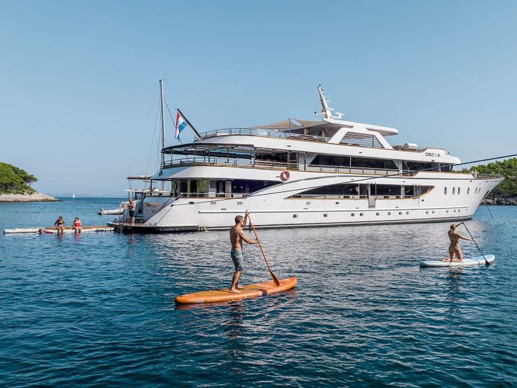 CRISTAL 49m Custom Motor Yacht anchored with water toys