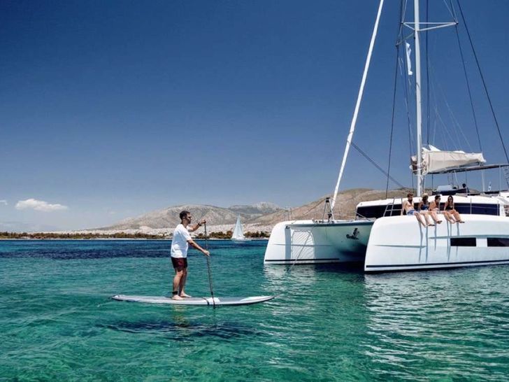 DOLCE VITA Dufour 48 - with the guests paddle boarding DOLCE VITA Dufour 48 - with the guests paddle boarding