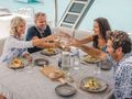 GRACE Aquila 54 - Guests Dining Al Fresco on the Flybridge GRACE Aquila 54 - Guests Dining Al Fresco on the Flybridge