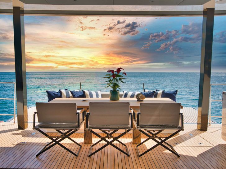 GINETTE - aft deck alfresco dining during sunset GINETTE - aft deck alfresco dining during sunset