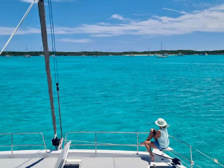 NAUTI DOGS 5.4 Bali 5.4 - guest on the foredeck NAUTI DOGS 5.4 Bali 5.4 - guest on the foredeck