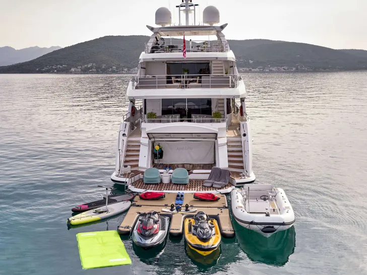 AQUA LIBRA Sunseeker 131 - aft shot with the water toys AQUA LIBRA Sunseeker 131 - aft shot with the water toys