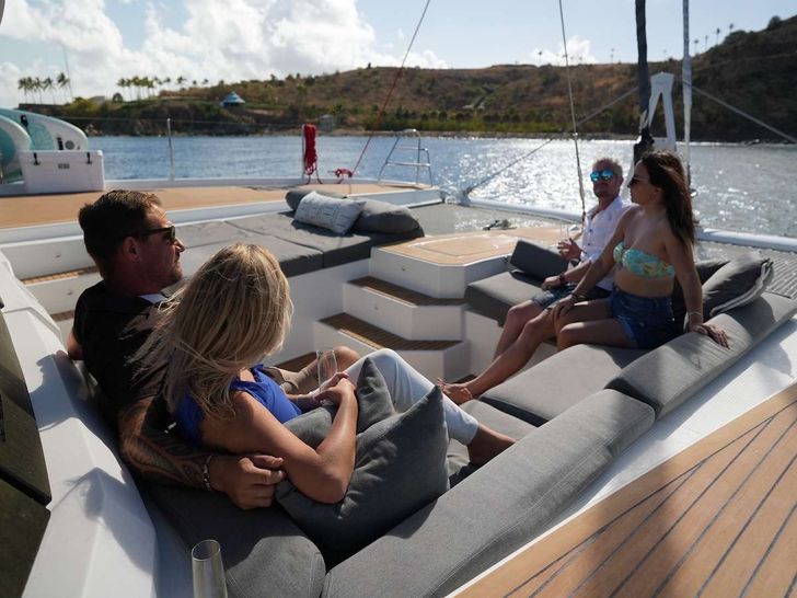 TRU NORTH Fountaine Pajot Alegria 67 Crewed Catamaran Guests Enjoying Sunbeds TRU NORTH Fountaine Pajot Alegria 67 Crewed Catamaran Guests Enjoying Sunbeds