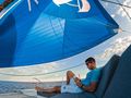 AMANTE Fountaine Pajot Saba 50 - guest lounging on the foredeck AMANTE Fountaine Pajot Saba 50 - guest lounging on the foredeck