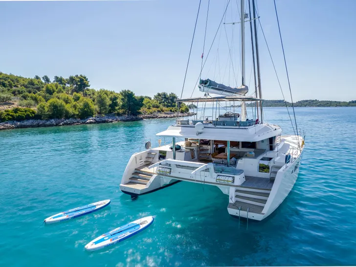 COOL CHANGE Lagoon 560 - aft shot with the paddleboards COOL CHANGE Lagoon 560 - aft shot with the paddleboards