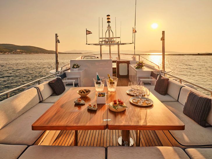 ALAYA - Lurssen 33 m,flybridge alfresco dining area under the sunset