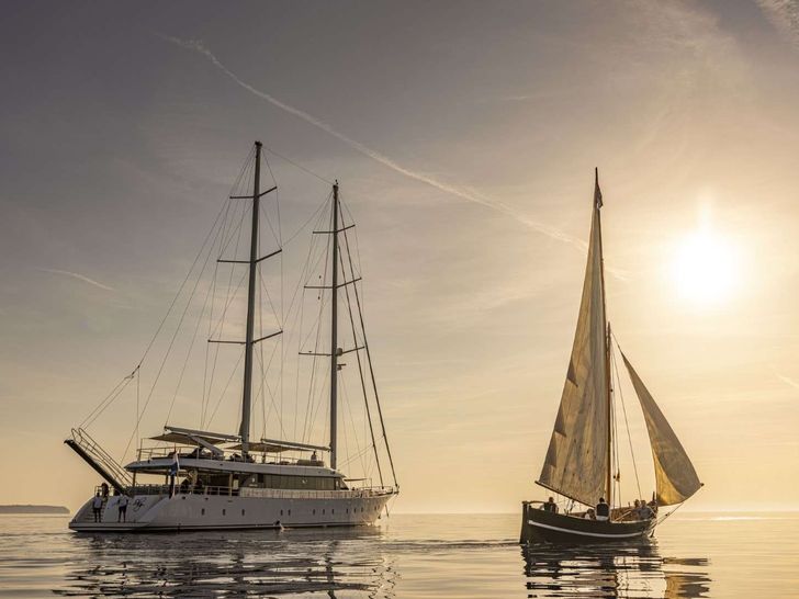 AURUM SKY - Custom Sailing Yacht 43m,anchored under the sunset AURUM SKY - Custom Sailing Yacht 43m,anchored under the sunset