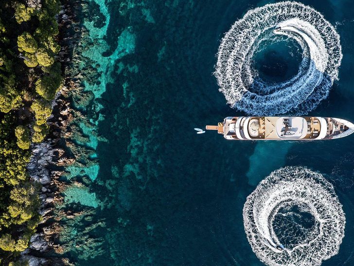 BLACK SWAN - Custom Yacht 50 m,aerial view anchored with jet skis BLACK SWAN - Custom Yacht 50 m,aerial view anchored with jet skis