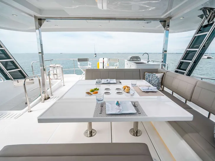 A YACHTA FUN Aquila 54 - Flybridge Dining and Seating Area A YACHTA FUN Aquila 54 - Flybridge Dining and Seating Area