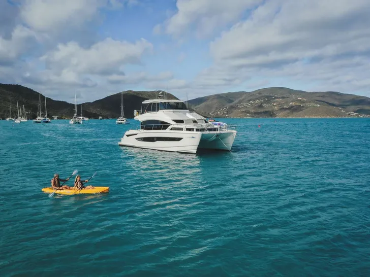 A YACHTA FUN Aquila 54 - Anchored With Paddle Board A YACHTA FUN Aquila 54 - Anchored With Paddle Board