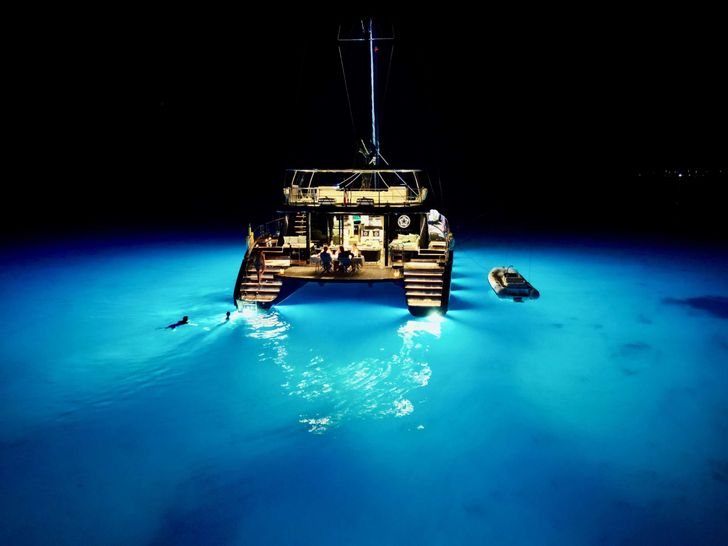 ONE PLANET Sunreef 70 Eco - anchored at night ONE PLANET Sunreef 70 Eco - anchored at night