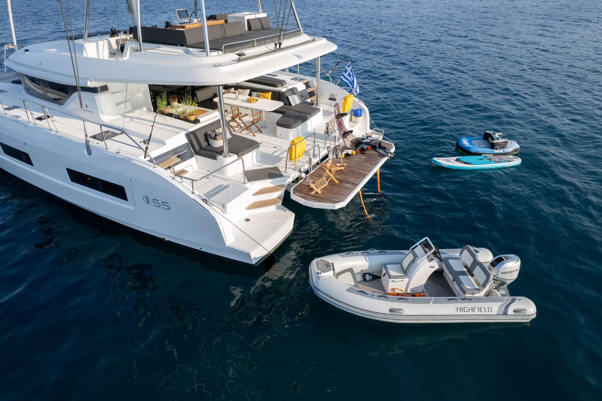 ADEL Lagoon 55 - aft shot with the tender and paddleboards