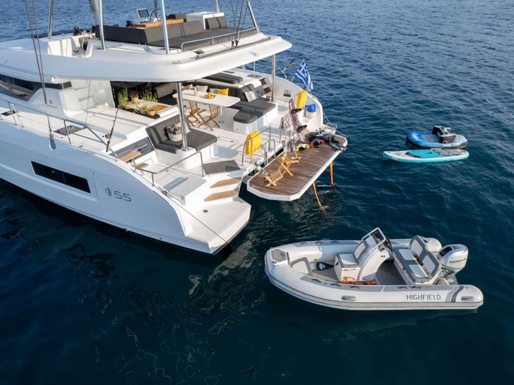 ADEL Lagoon 55 - aft shot with the tender and paddleboards ADEL Lagoon 55 - aft shot with the tender and paddleboards