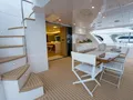 SALUS - Horizon 60,aft alfresco dining area with staircase to the flybridge SALUS - Horizon 60,aft alfresco dining area with staircase to the flybridge