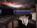 GALAXY - Benetti 56 m,entertainment area with light projector displaying the galaxy GALAXY - Benetti 56 m,entertainment area with light projector displaying the galaxy