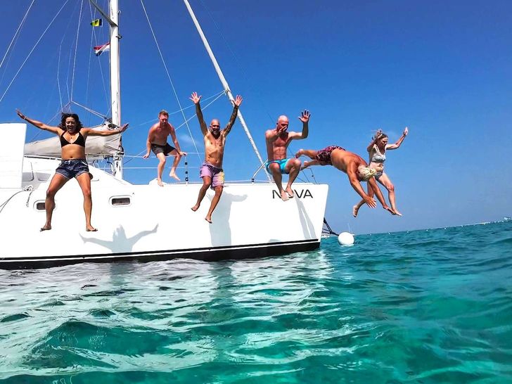 NOVA Robertson and Caine 43 - guests jumping into the water NOVA Robertson and Caine 43 - guests jumping into the water