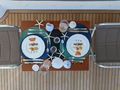 AMMONITE Nordhavn Custom 23m - beach style dining set up AMMONITE Nordhavn Custom 23m - beach style dining set up