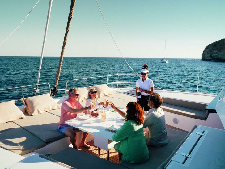 MOTEK Bali 5.4 - guests on the foredeck MOTEK Bali 5.4 - guests on the foredeck