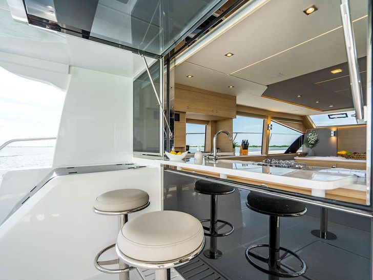 PAINTED PELICAN Aquila 54 - Aft Deck Seating outside of Galley Window PAINTED PELICAN Aquila 54 - Aft Deck Seating outside of Galley Window