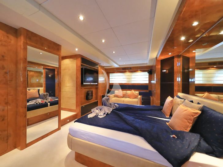 888 Riva 85 Opera Super - master cabin bed and seating area with TV 888 Riva 85 Opera Super - master cabin bed and seating area with TV