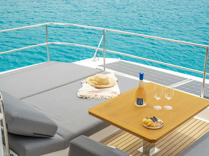 SEMPER FIDELIS Fountaine Pajot Alegria 67 - flybridge aft sunbathing area with a table SEMPER FIDELIS Fountaine Pajot Alegria 67 - flybridge aft sunbathing area with a table