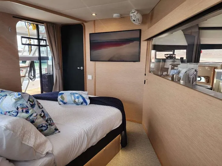 NEPTUNE'S ESCAPE Neel 52 - master cabin bed and TV NEPTUNE'S ESCAPE Neel 52 - master cabin bed and TV
