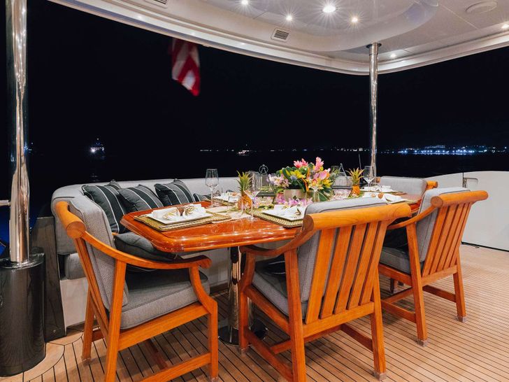 TEMPTATION Palmer Johnson 123 - aft deck dining area TEMPTATION Palmer Johnson 123 - aft deck dining area