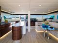 DESSUS Sunreef 60 - saloon seating and galley with a bar in the middle DESSUS Sunreef 60 - saloon seating and galley with a bar in the middle