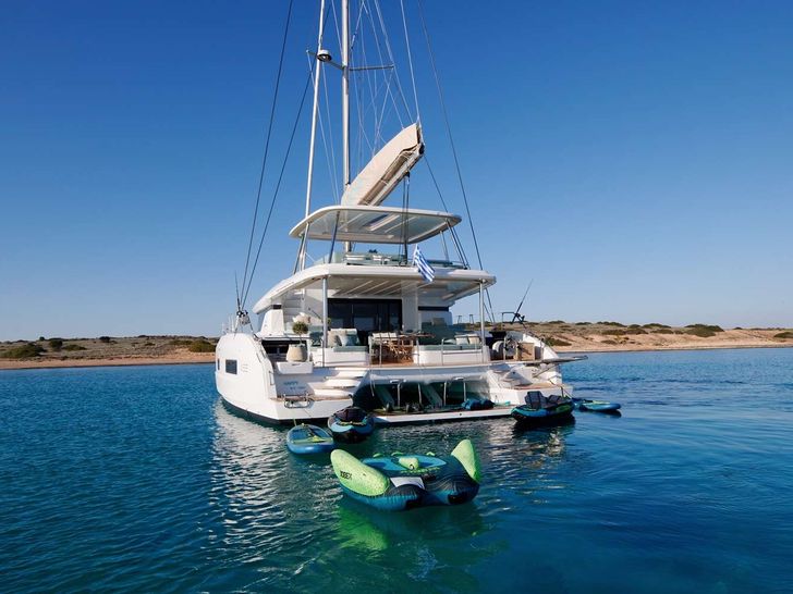 HAPPY Lagoon 55 - anchored aft shot with the water toys HAPPY Lagoon 55 - anchored aft shot with the water toys