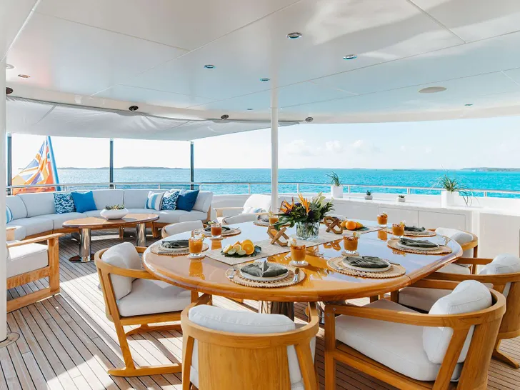 ODYSSEA Heesen 47m Steel - alfresco dining area in the sky deck ODYSSEA Heesen 47m Steel - alfresco dining area in the sky deck