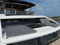 XQUISITE HYBRID Xquisite 60 Solar Power - Bronzing Area on Foredeck XQUISITE HYBRID Xquisite 60 Solar Power - Bronzing Area on Foredeck