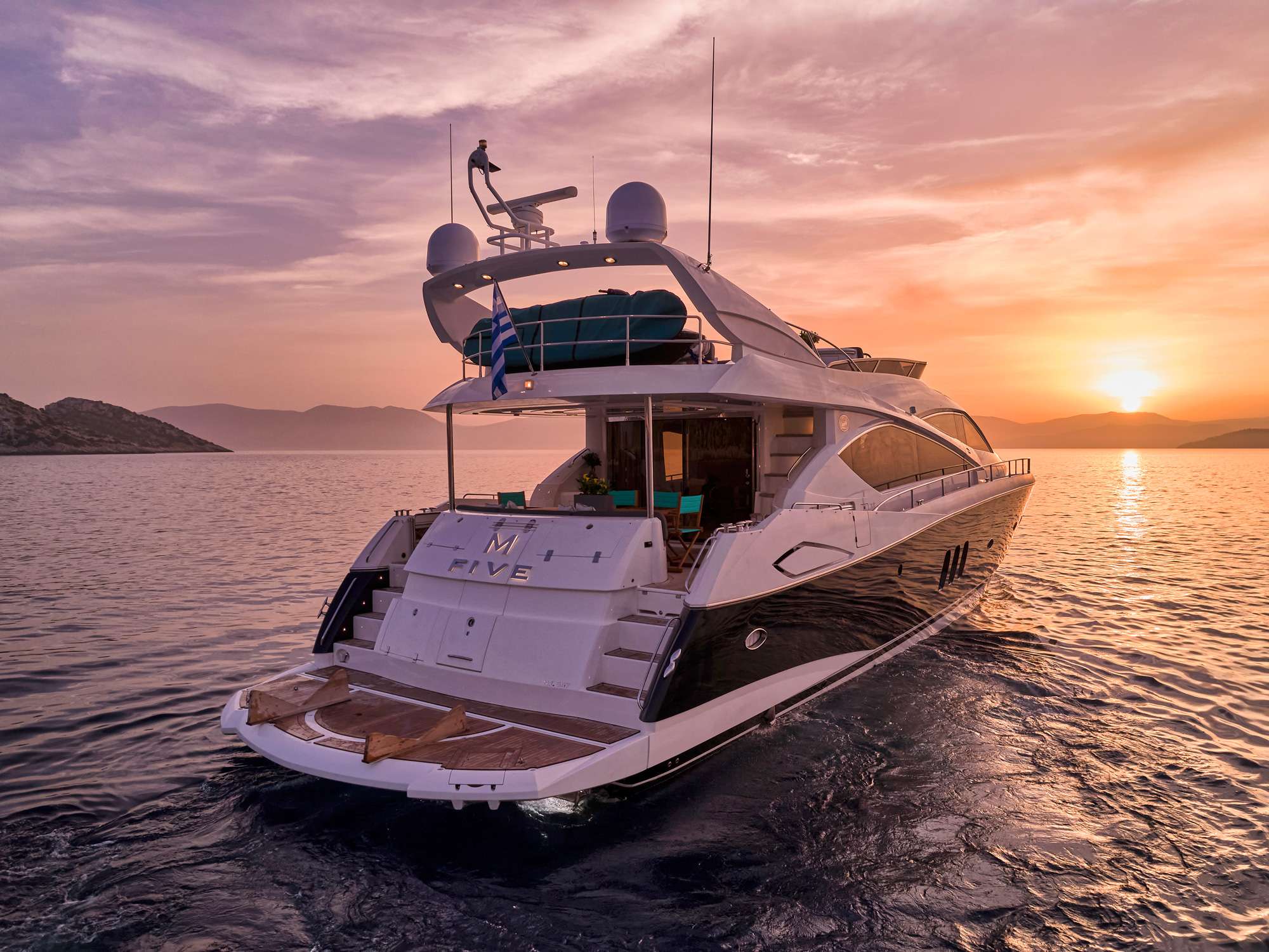 M FIVE Sunseeker 75 Yacht - aft shot under the sunset