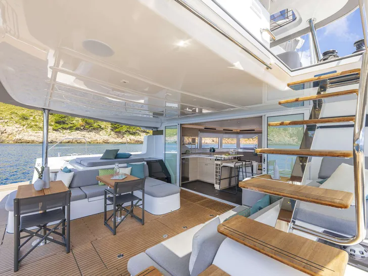LADY M Lagoon 60 - aft deck seating and stairs to the flybridge LADY M Lagoon 60 - aft deck seating and stairs to the flybridge