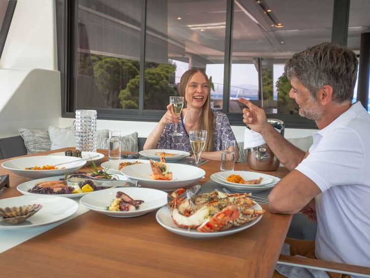 MAJESTY OF GREECE Fountaine Pajot Power 67 - aft deck dining MAJESTY OF GREECE Fountaine Pajot Power 67 - aft deck dining