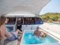 MAJESTY OF GREECE Fountaine Pajot Power 67 - guests in the jacuzzi MAJESTY OF GREECE Fountaine Pajot Power 67 - guests in the jacuzzi