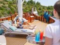GREEN RAY Custom Gulet 28m - guests sunbathing GREEN RAY Custom Gulet 28m - guests sunbathing