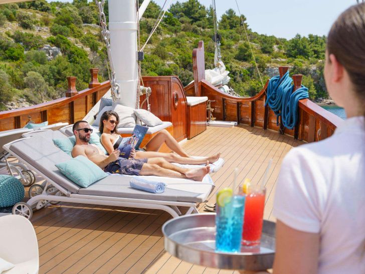 GREEN RAY Custom Gulet 28m - guests sunbathing GREEN RAY Custom Gulet 28m - guests sunbathing