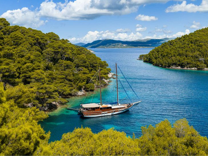 ELEGANZA Custom Gulet 27m - anchored near an island ELEGANZA Custom Gulet 27m - anchored near an island